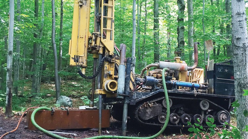 Drill rig in a wooded area