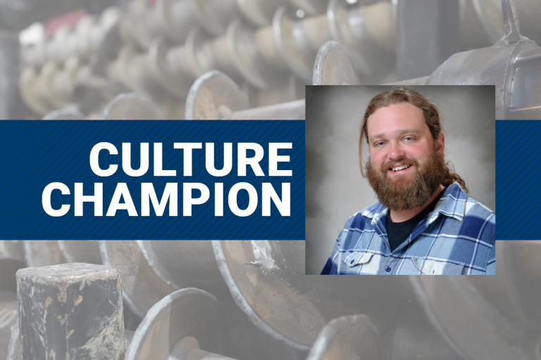The text Culture Champion and a photo of Joe Nitsch with augers in the background.