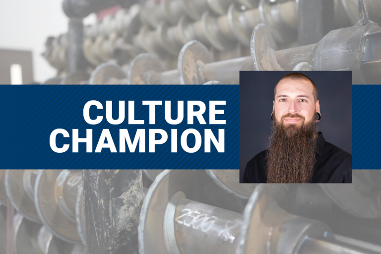 Graphic featuring the words ‘Culture Champion’ over a background of drilling equipment, with a portrait of Kevin Kenneson displayed on the right.