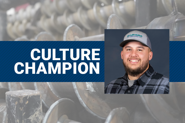 The text Culture Champion and a photo of Jay Adams with augers in the background.